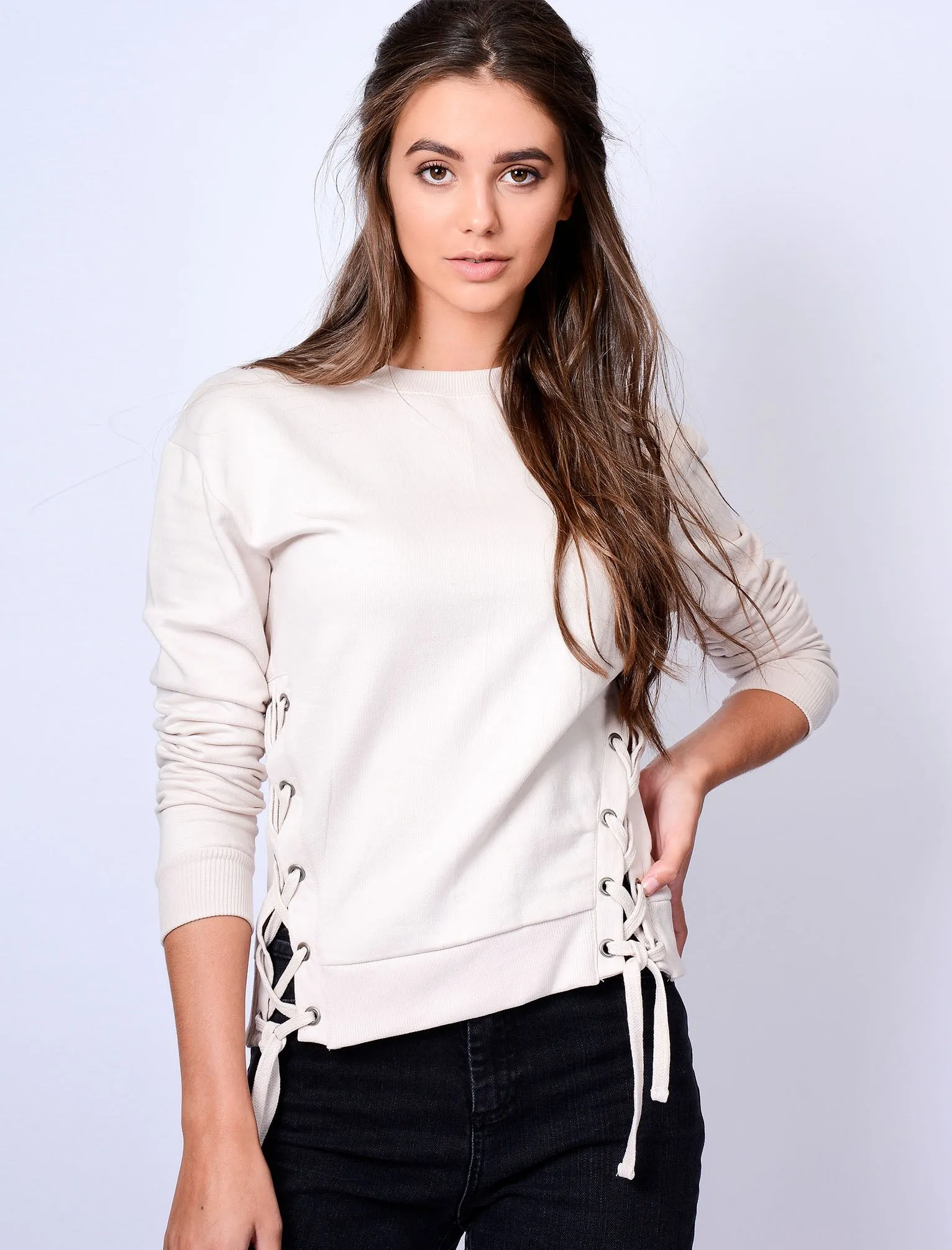 Arrow Cropped Sweatshirt with Lace Up Eyelets in White Asparagus - Amara Reya